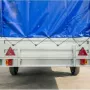 Автомобильный прицеп Кремень бизнес (3,0х1,56х0,50 м ресс. AL-KO, тент Аэро)